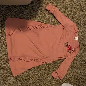 Dark pink dress with ruffles and a rose